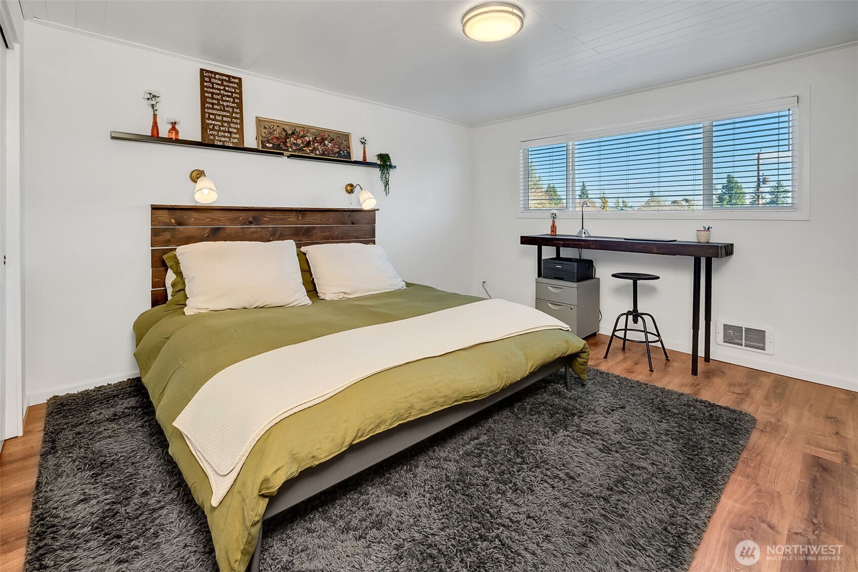 A WFH desk is easily accommodated in the large bedroom.