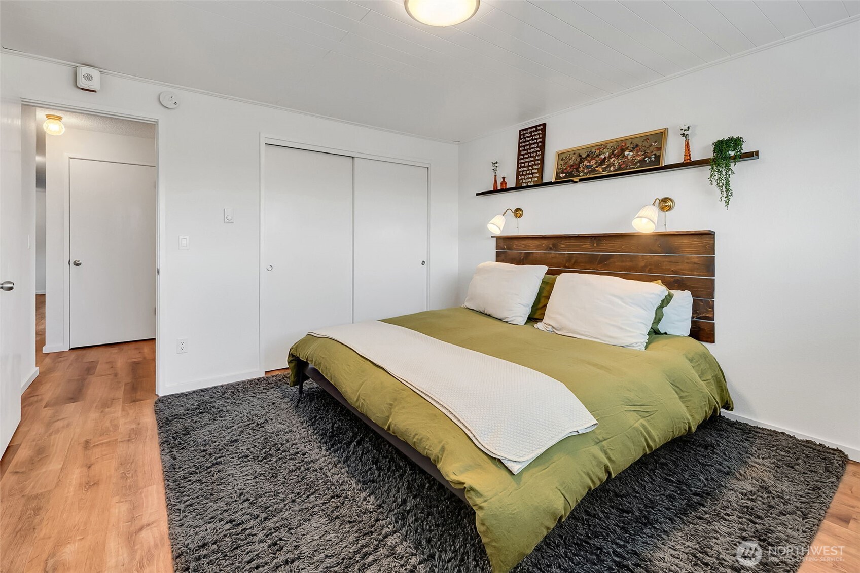 Updated bathroom with newer sink, vanity and tile.