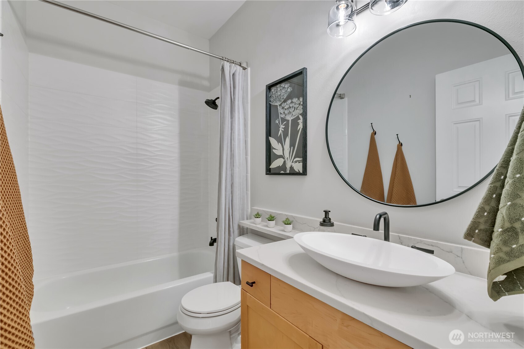 Main bathroom features a combination bathtub and shower.