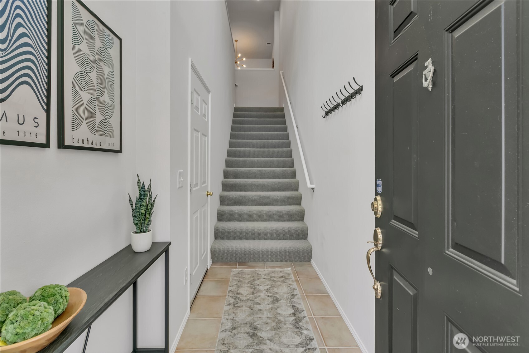 Through front door, lower-level entry off the garage with a convenient coat area, perfect for everyday drop zone before heading upstairs.