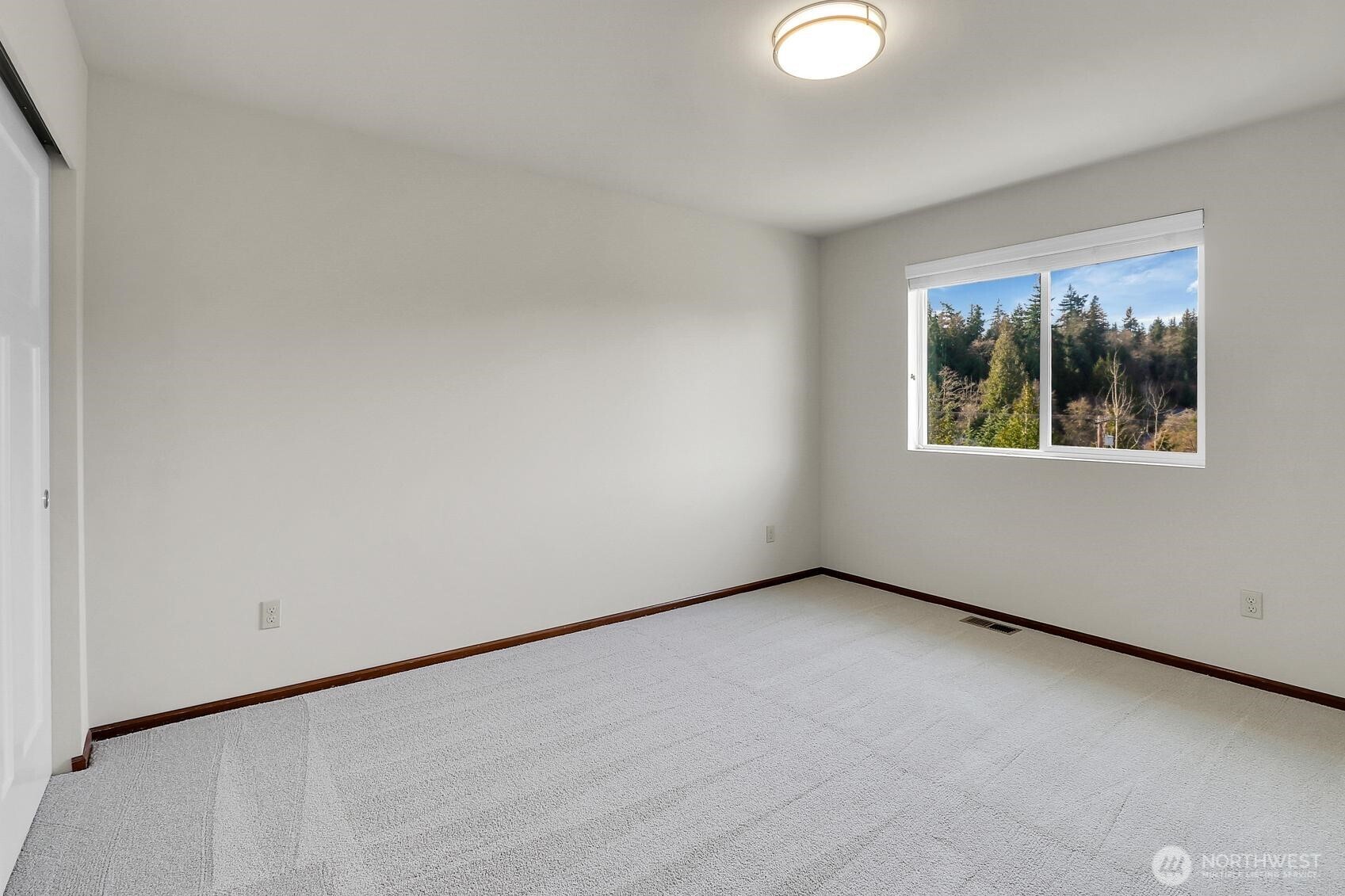 A convenient half-bath is also located on the upper level.