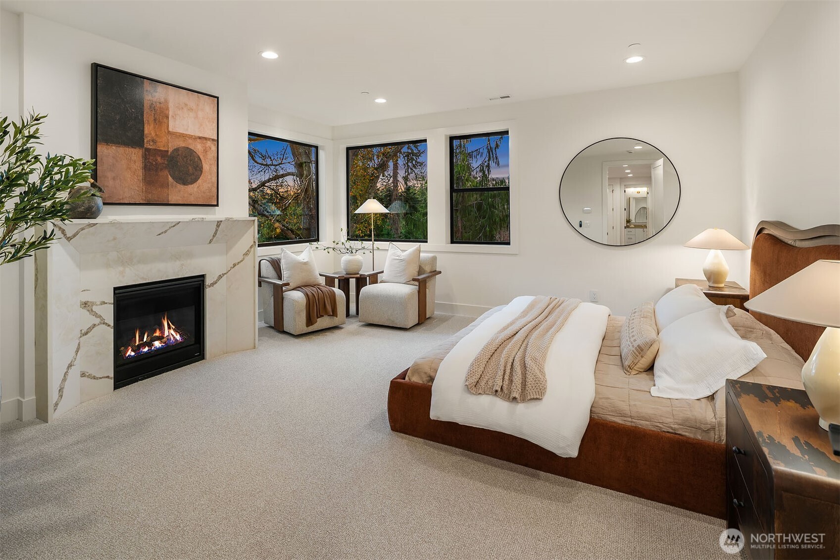 Designer primary suite with fireplace