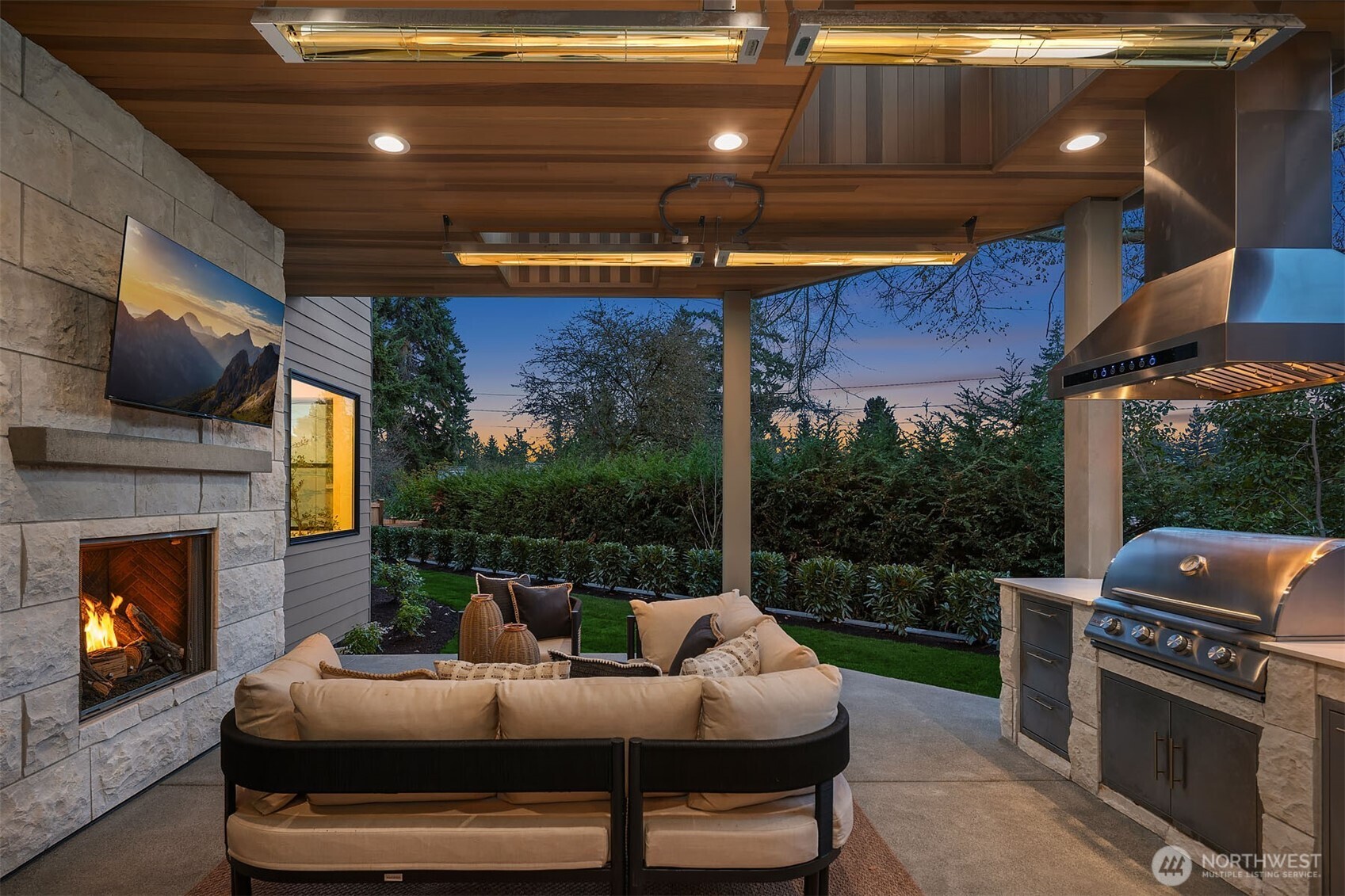 Outdoor covered living area with built in BBQ & fireplace