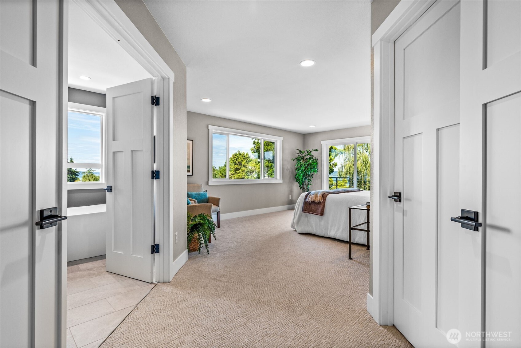 Double door entry to Primary Suite...you can already see the water views from each window.