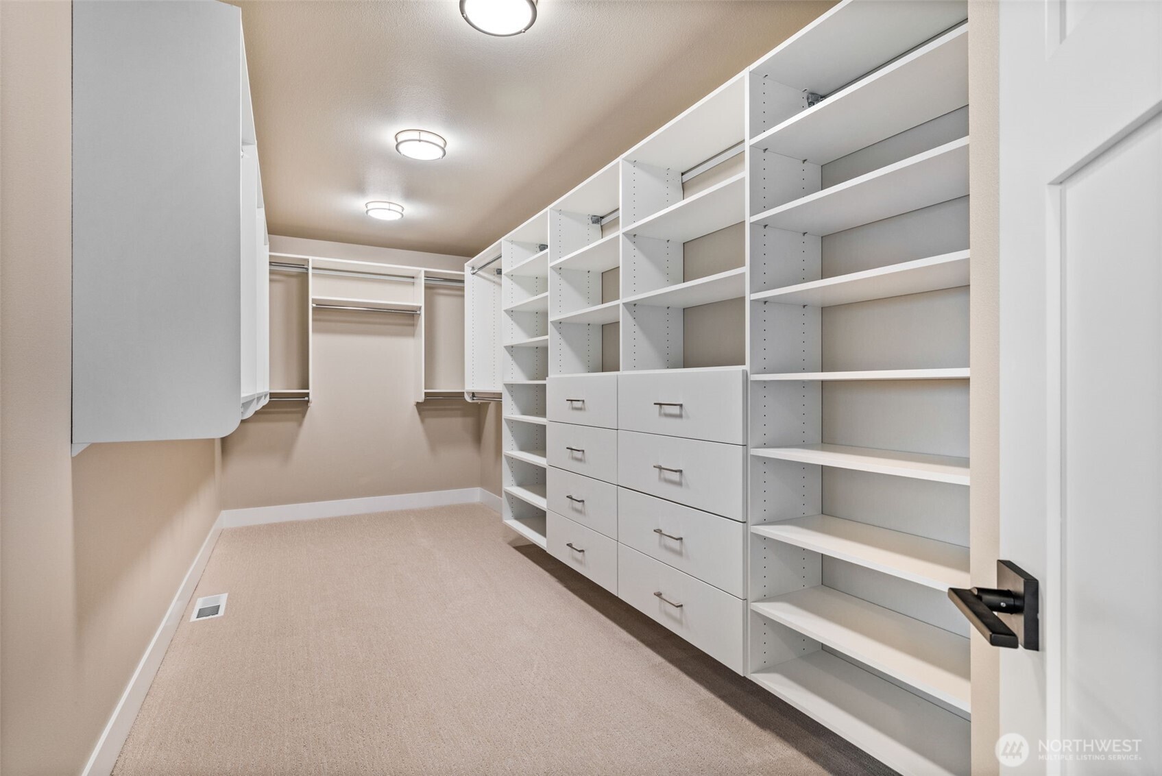 Walk in closet in Primary with custom built ins to make any discerning new homeowner happy!