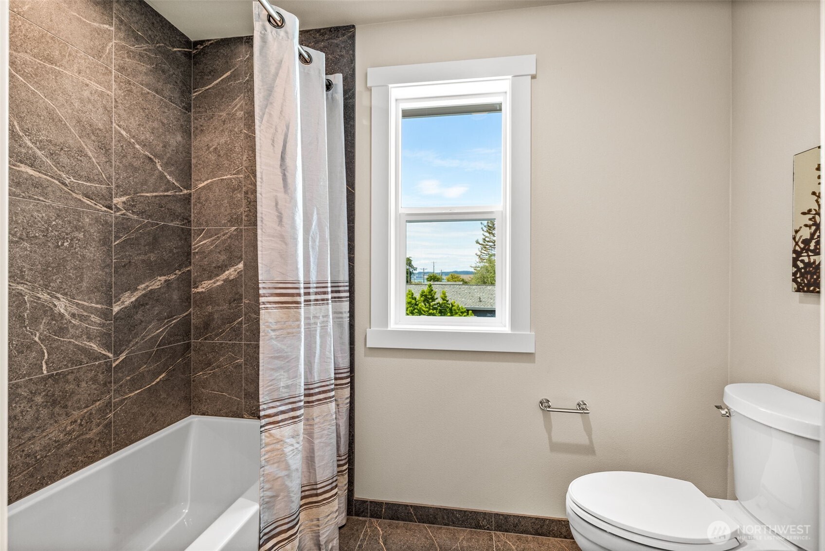 Separate shower room made private from the dual vanities in main hall bath,