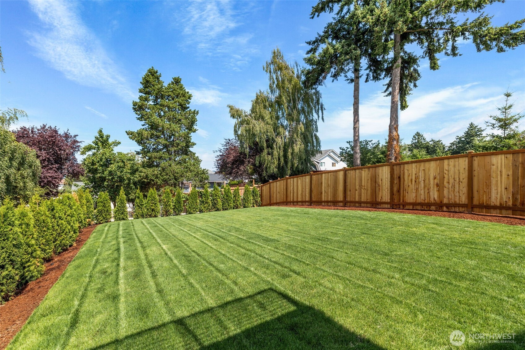 Lush landscaping installed, complete with full sprinkler system.