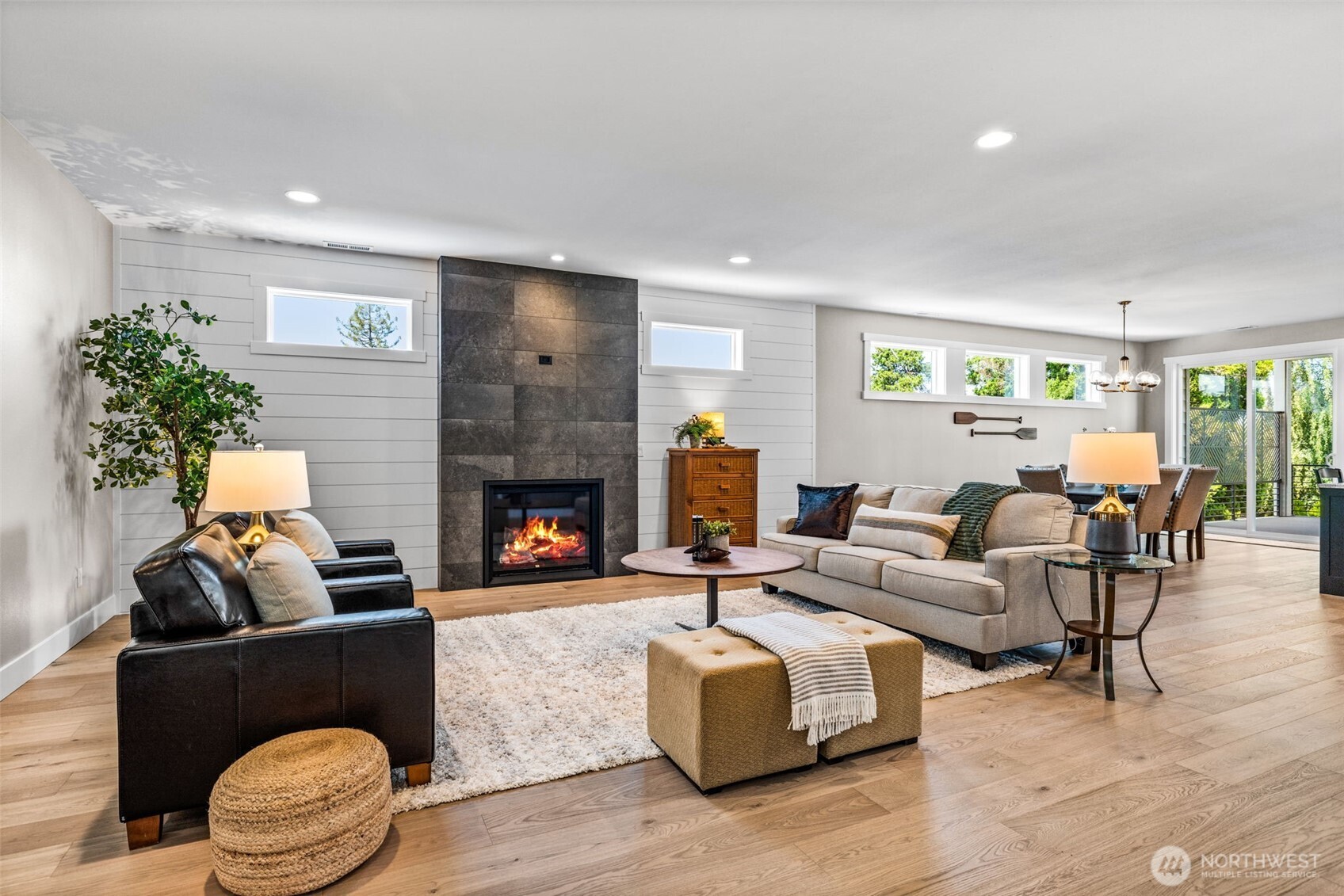 Great room with abundant natural light & handsome wide plank white oak flooring