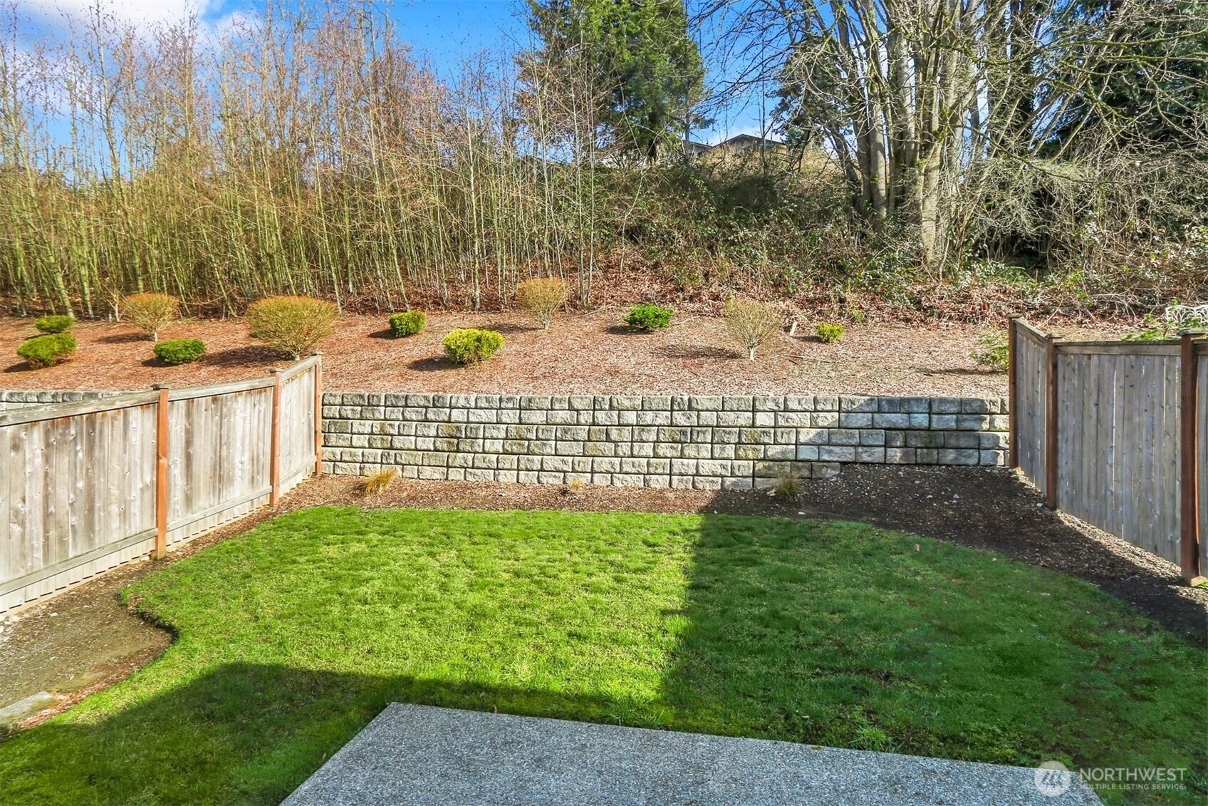 Private partially-fenced backyard and patio, perfect for outdoor entertaining!