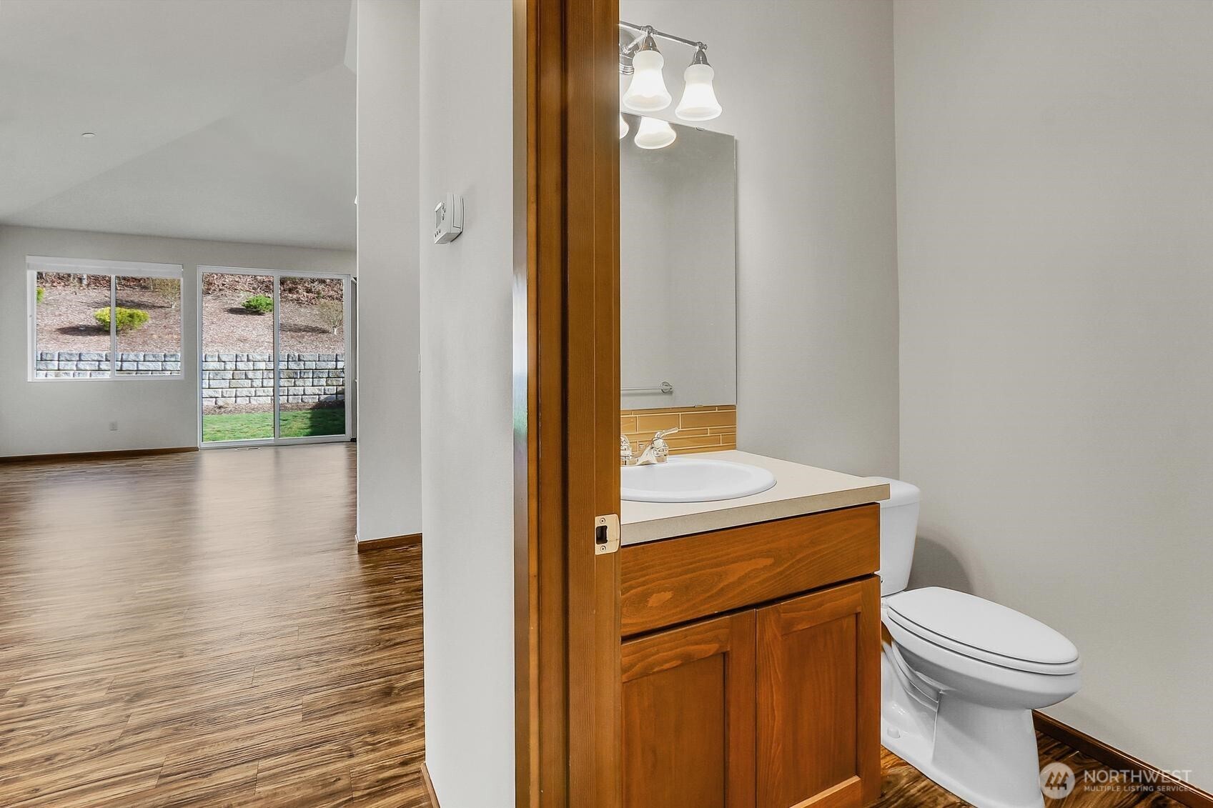 A convenient half-bath is also located on the upper level.
