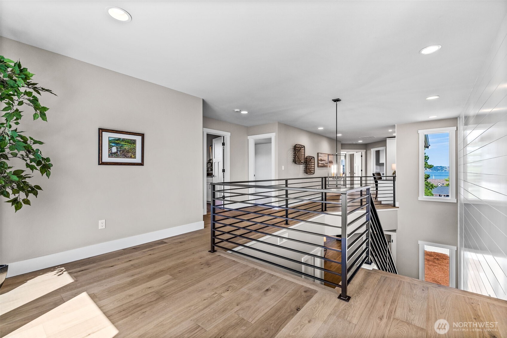 Open "room" at the top of the stairs, perfect for game table, chaise & bookshelf or additional desk area. Built in desk is down the hall a bit.