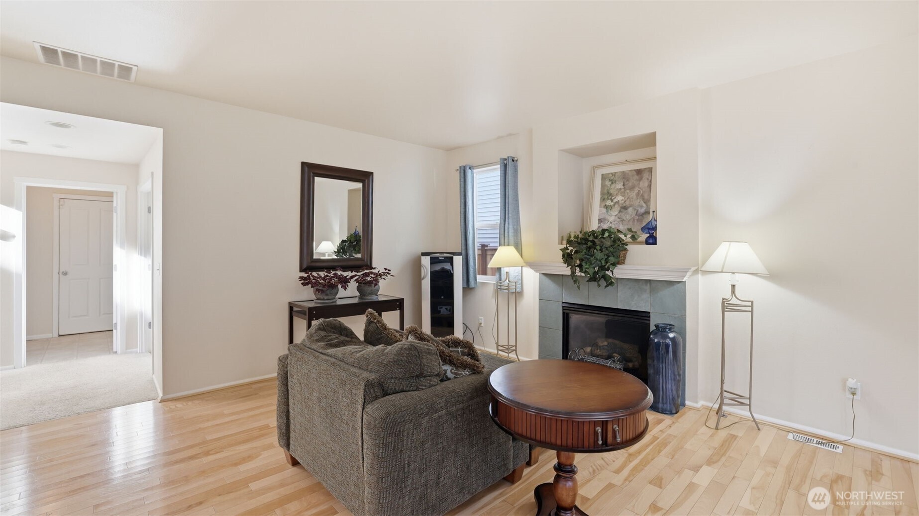 This inviting living room offers the perfect canvas, ready for you to make it your own.