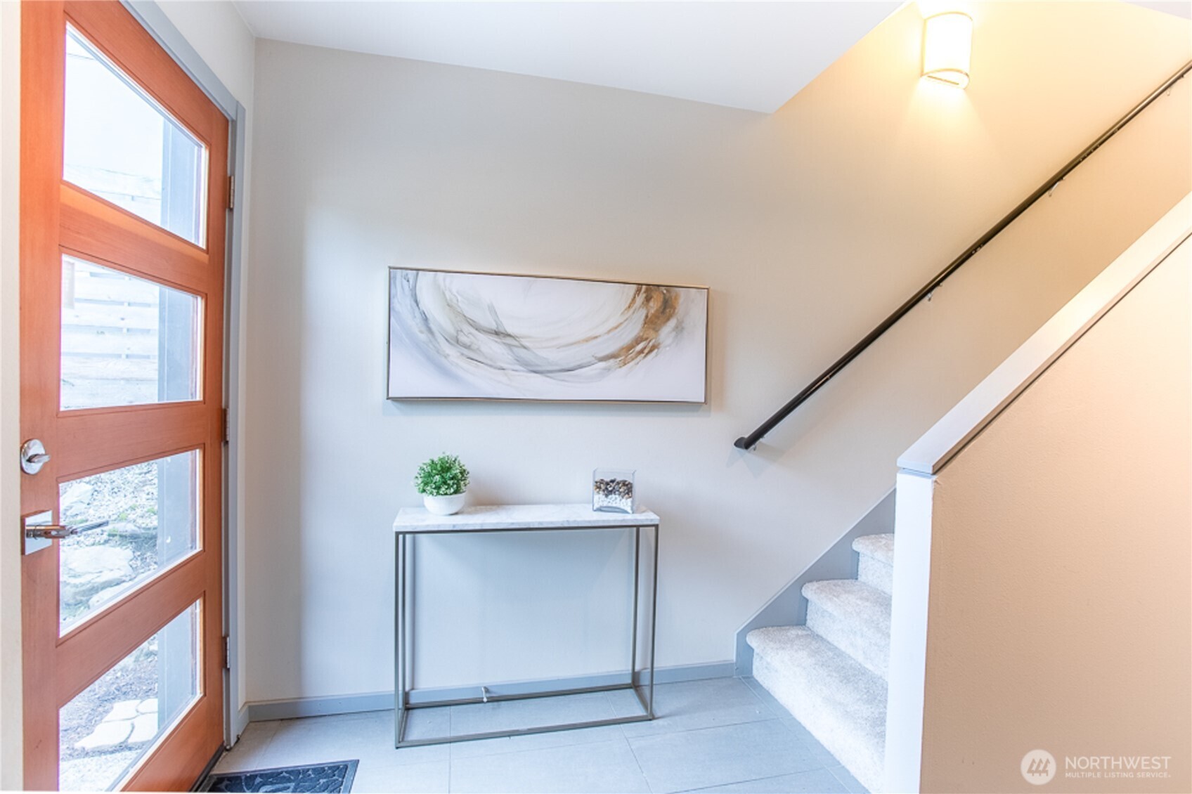 Spacious Entry.  Bedroom on the Main Floor (Entry Level) currently staged as a Home Office.  There is also a Full Bath on the Main Floor.