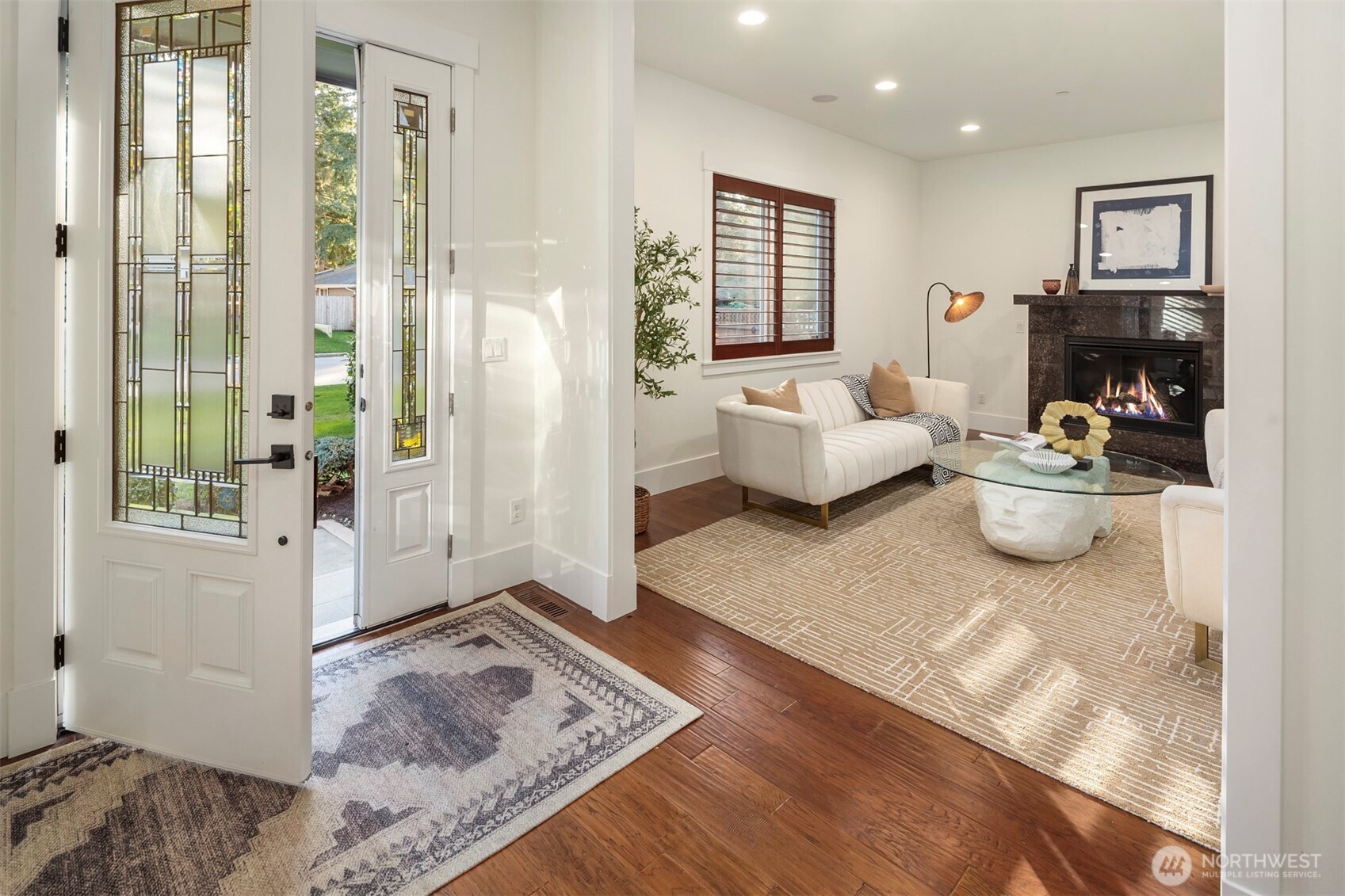 Elegant formal living room with a classic fireplace, perfect for refined gatherings and cozy evenings