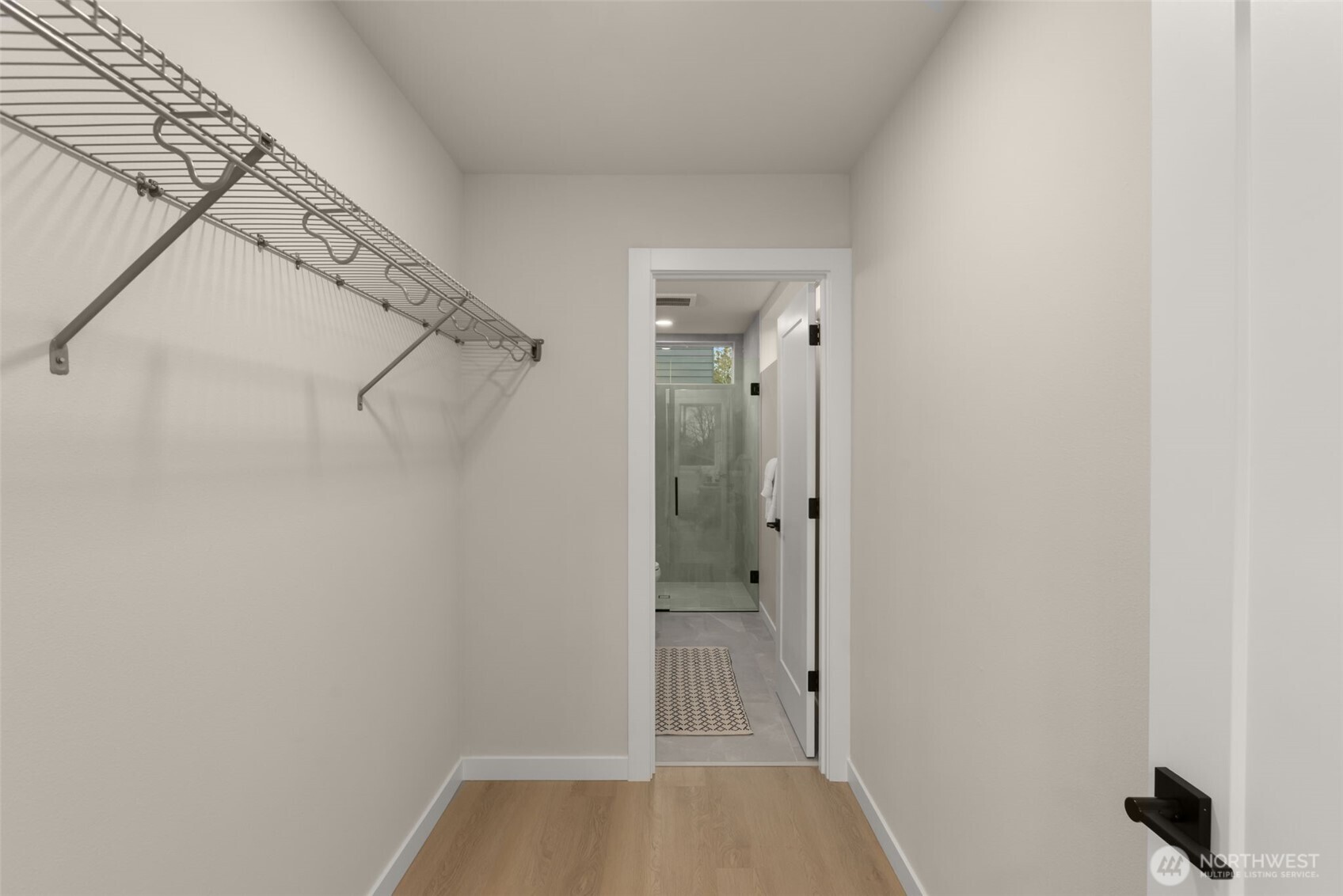 A large walk-in closet connects the en-suite bath to the primary