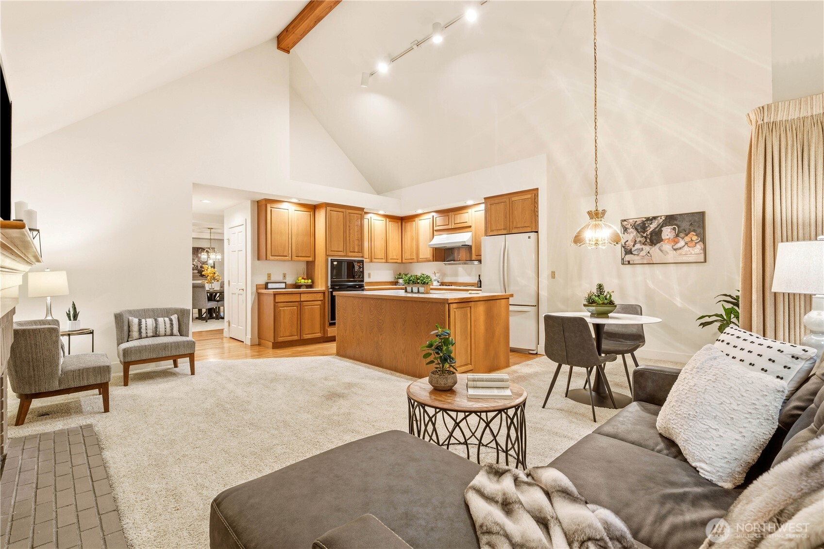 Kitchen and living room area with vaulted