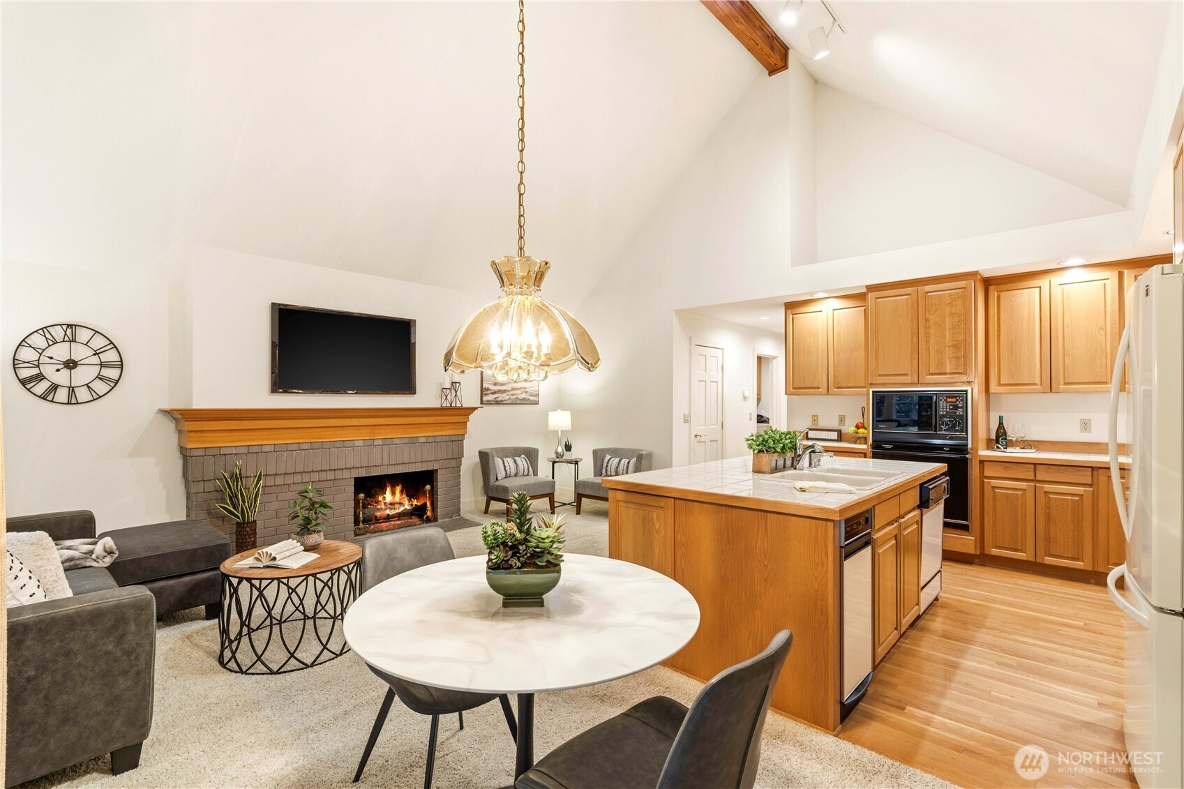 Kitchen and living room area with vaulted