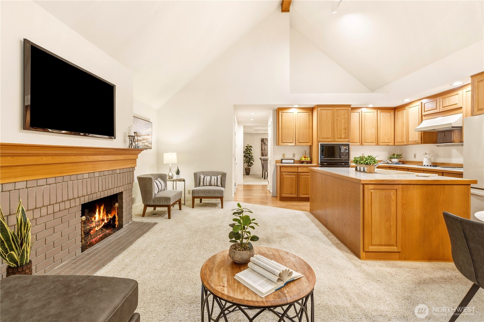Kitchen and living room area with vaulted