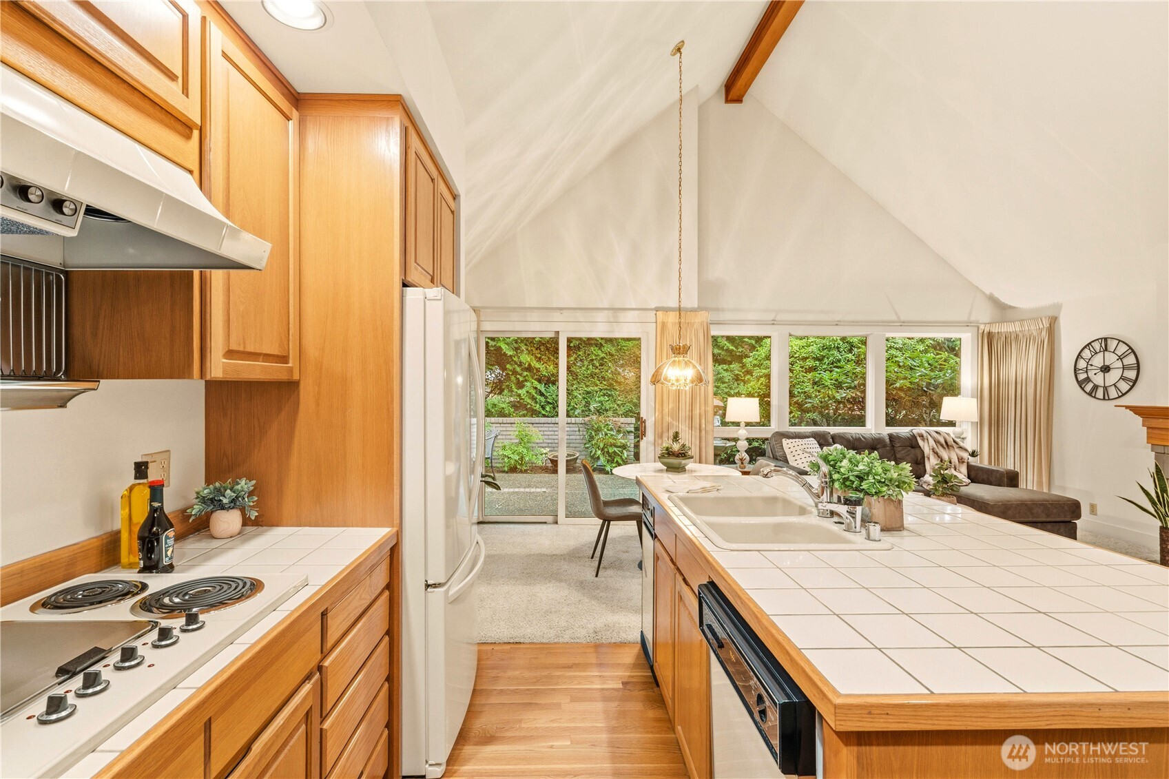 Kitchen and living room area with vaulted