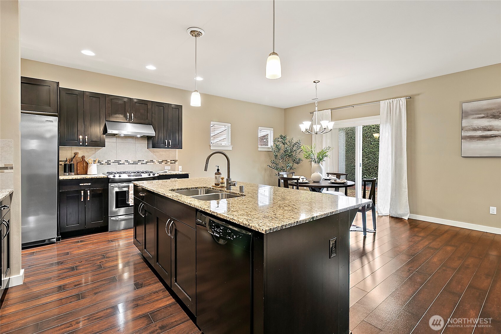 Open kitchen with large island, perfect for gatherings.