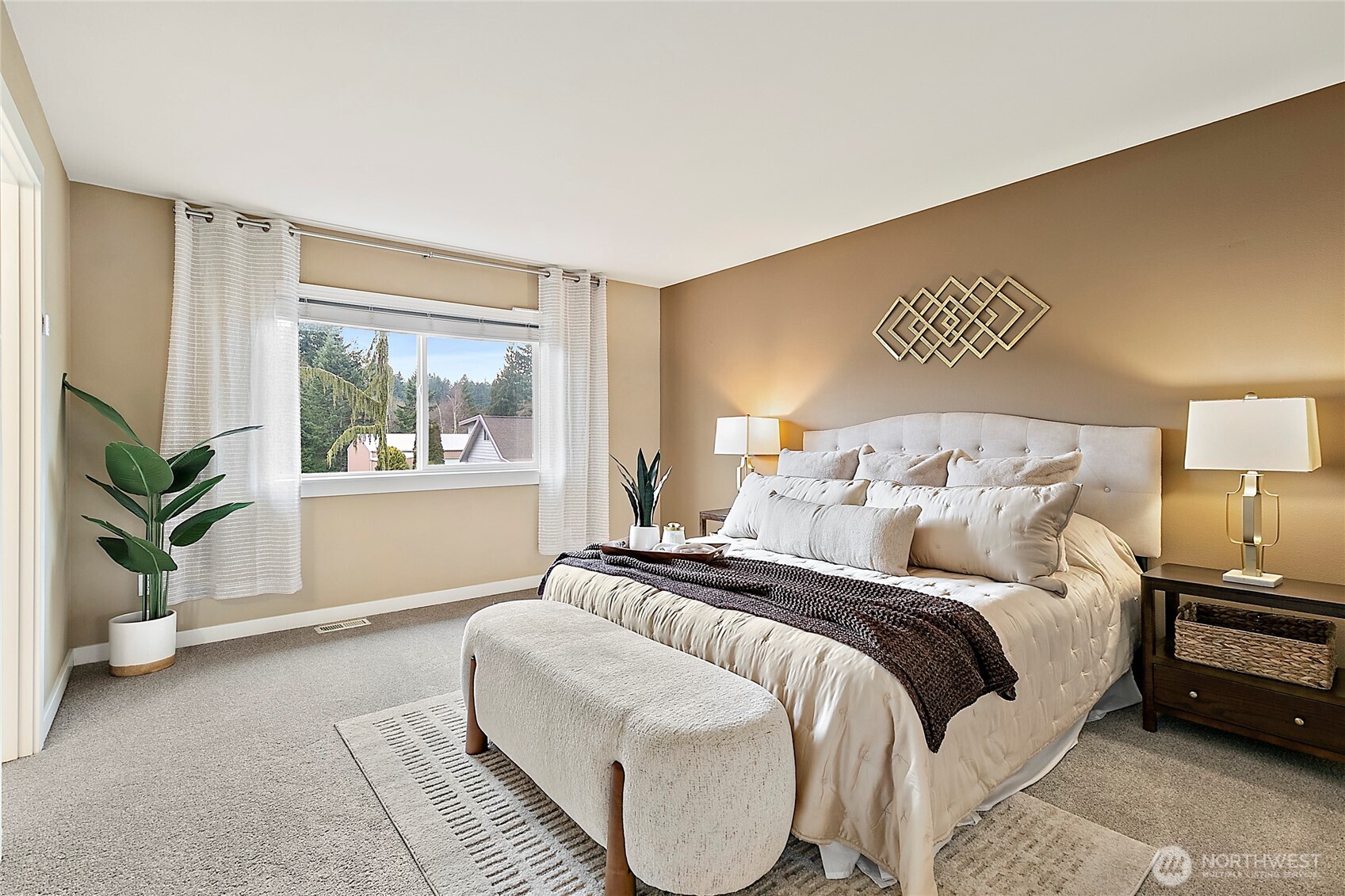 Spacious primary bedroom designed for relaxation.