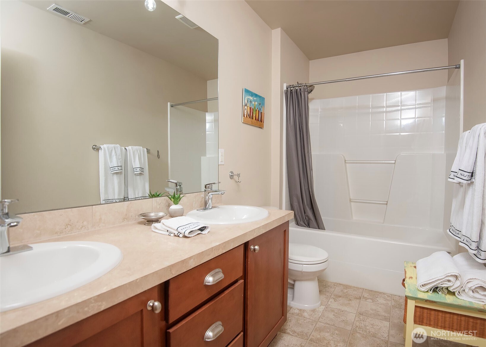 Main hall bathroom well appointed with two sinks.