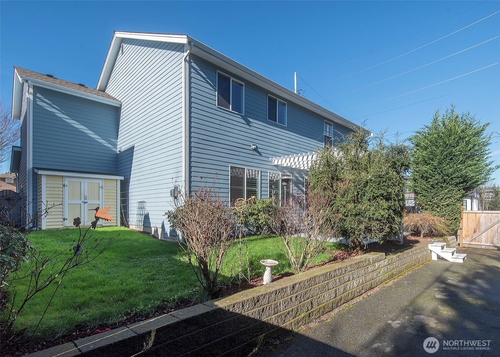 Fully usable backyard with a convenient garden shed.