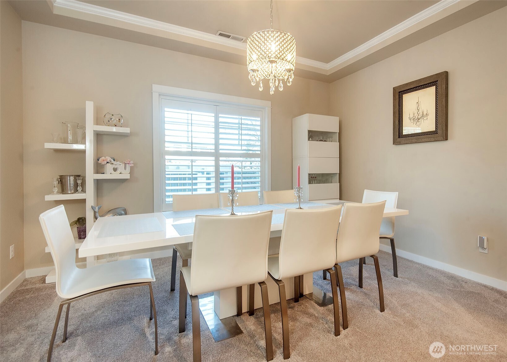 Formal dining space with crown molding.