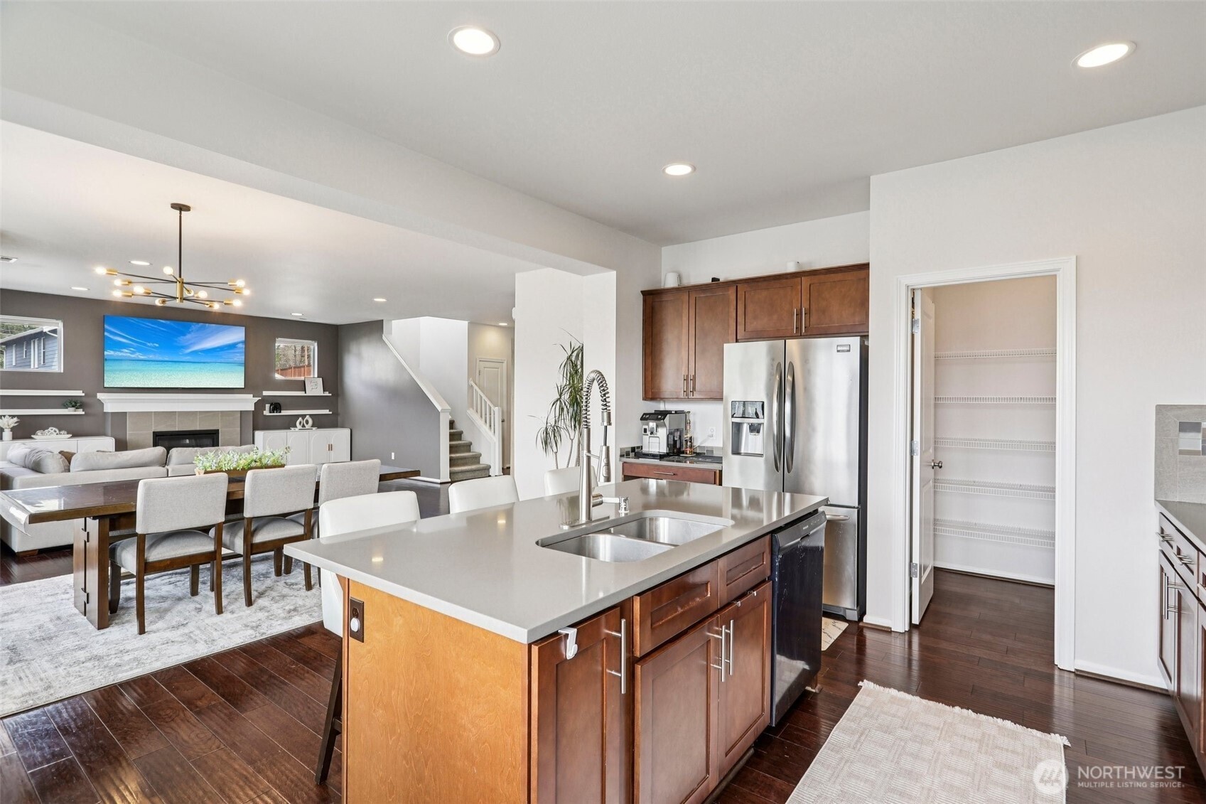 Gourmet kitchen with stainless appliances and walk-in pantry.