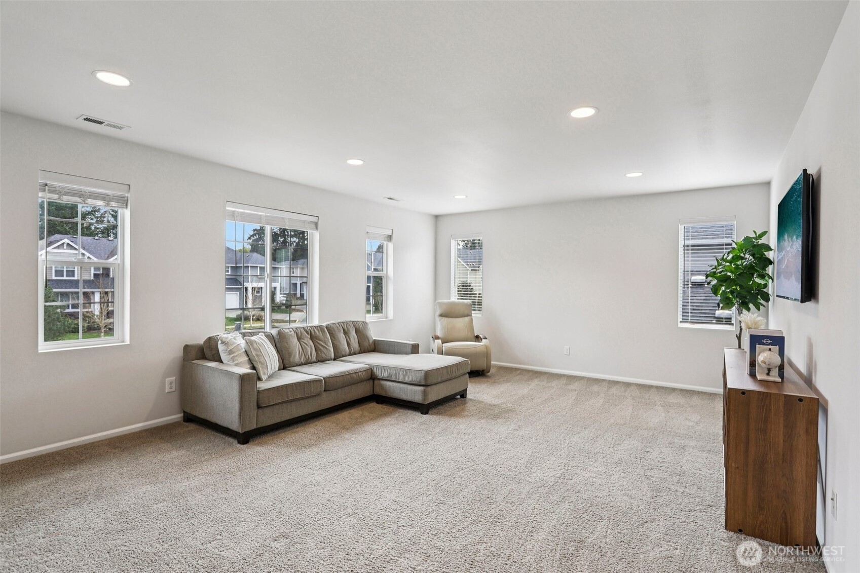 Spacious guest bedroom that can be a sizeable media room with closet space.
