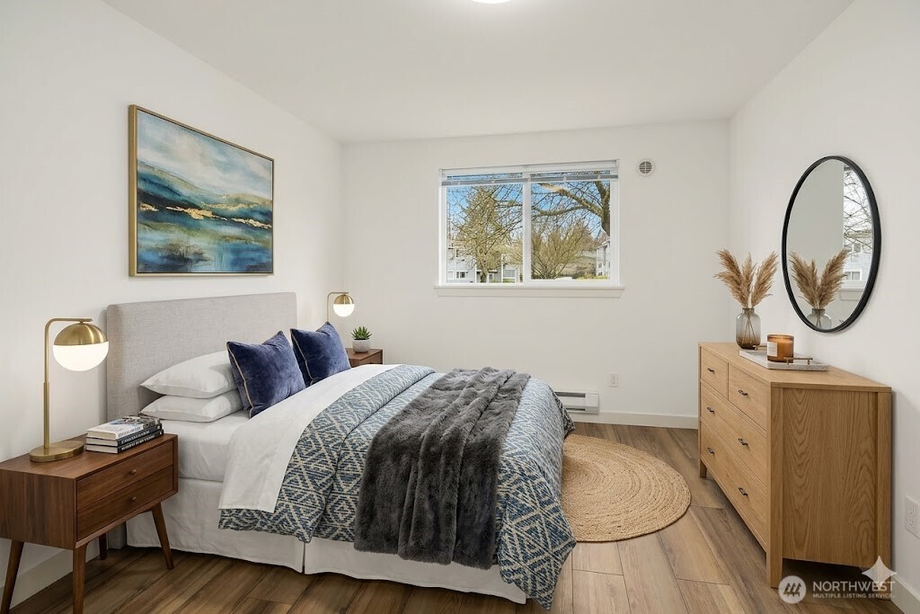 South facing bedroom #2. Fresh paint, 3 years old LVP flooring, and plenty of sunshine streaming in. This bedroom overlooks parking lot and building entrance.