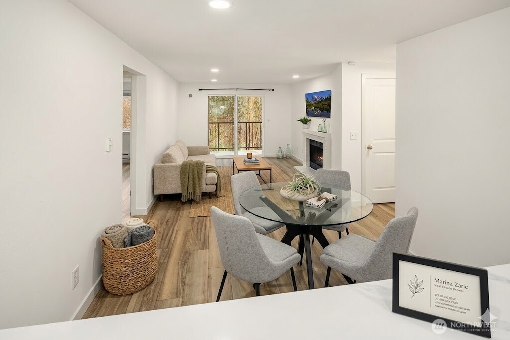Living room with dining and kitchen - one big space. LVP floors. This is the look from the deck/balcony.