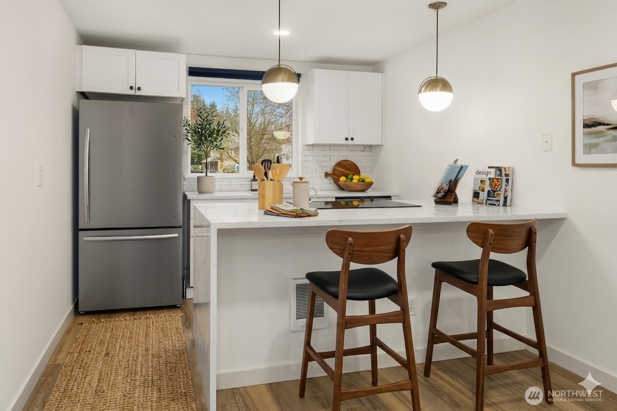 Kitchen is where we spend a lot of daytime and this is one has it all: bar are, quartz waterfall countertops, new SS appliances, freshly painted cabinet doors and plenty of light, not to mention modern fixtures.