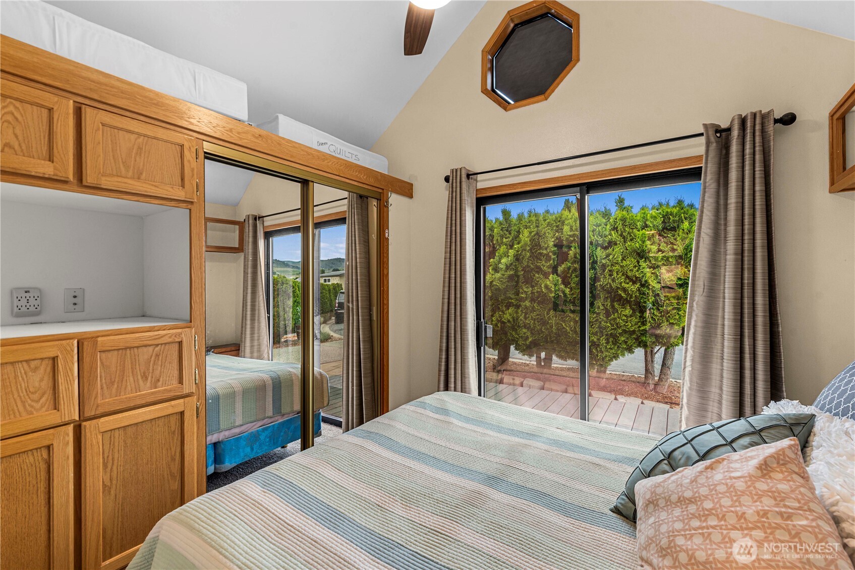 The bedroom has lots of built in storage. This is a queen bed.