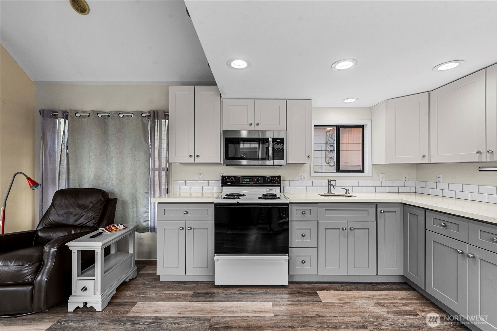The updated kitchen has lots of counter space and storage.