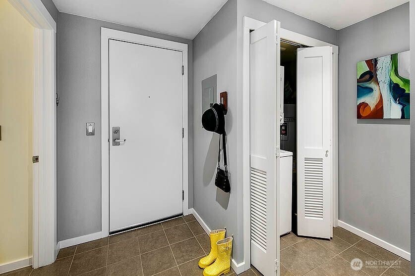 Great entry with a washer/dryer and coat closet.