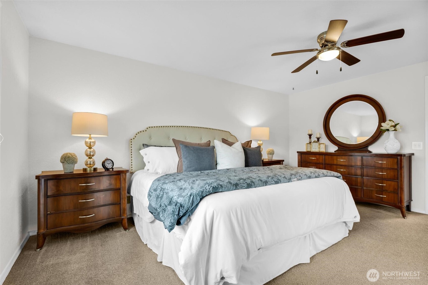 Large primary suite and paddle fan. Home also includes Heat Pump/AC cooling system. Photographed with King size bed.