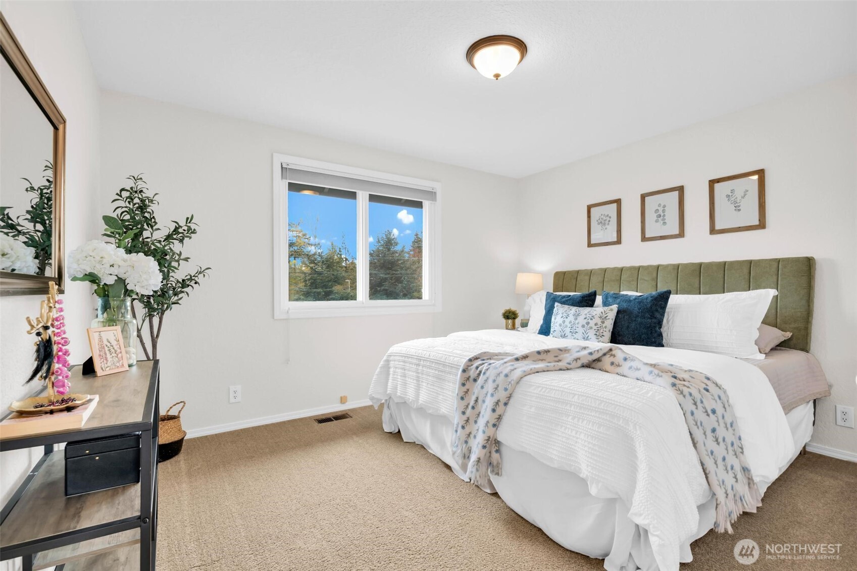 2nd large bedroom. Faces East, triple pane windows, photographed with king size bed.