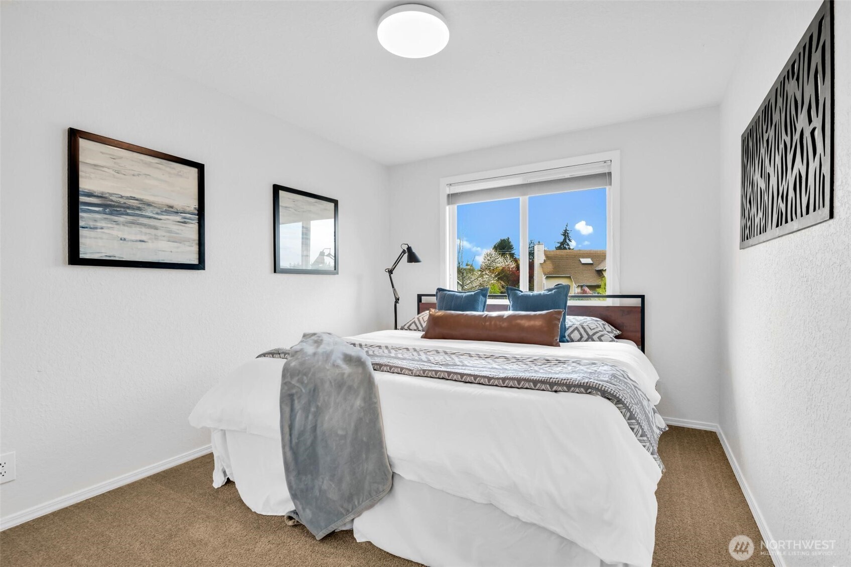 3rd bedroom faces West. Photographed with king size bed.