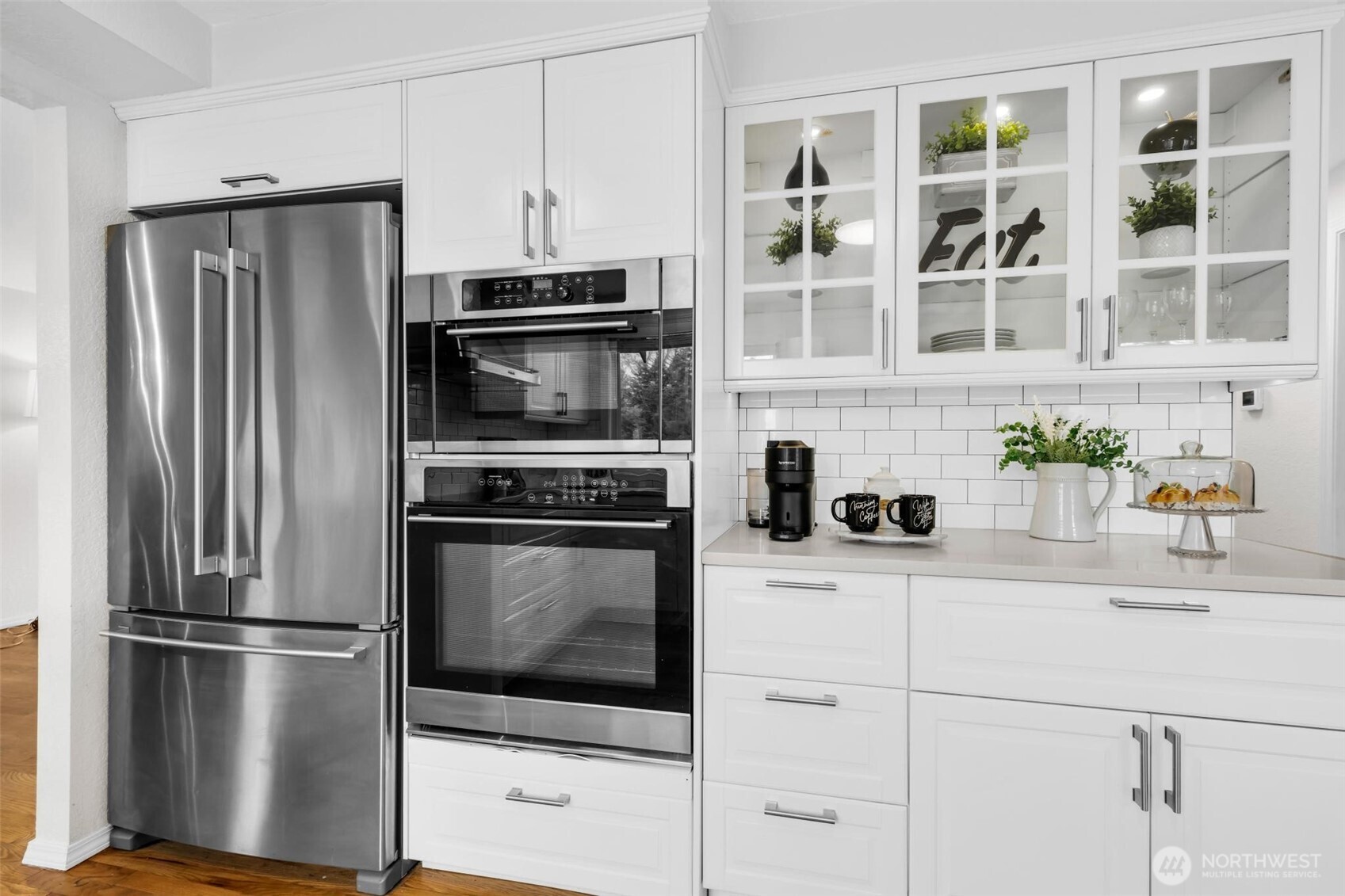 Oven, convection oven/microwave, ample storage AND built in pantry with soft close drawers. (Not photographed, come see in person!)