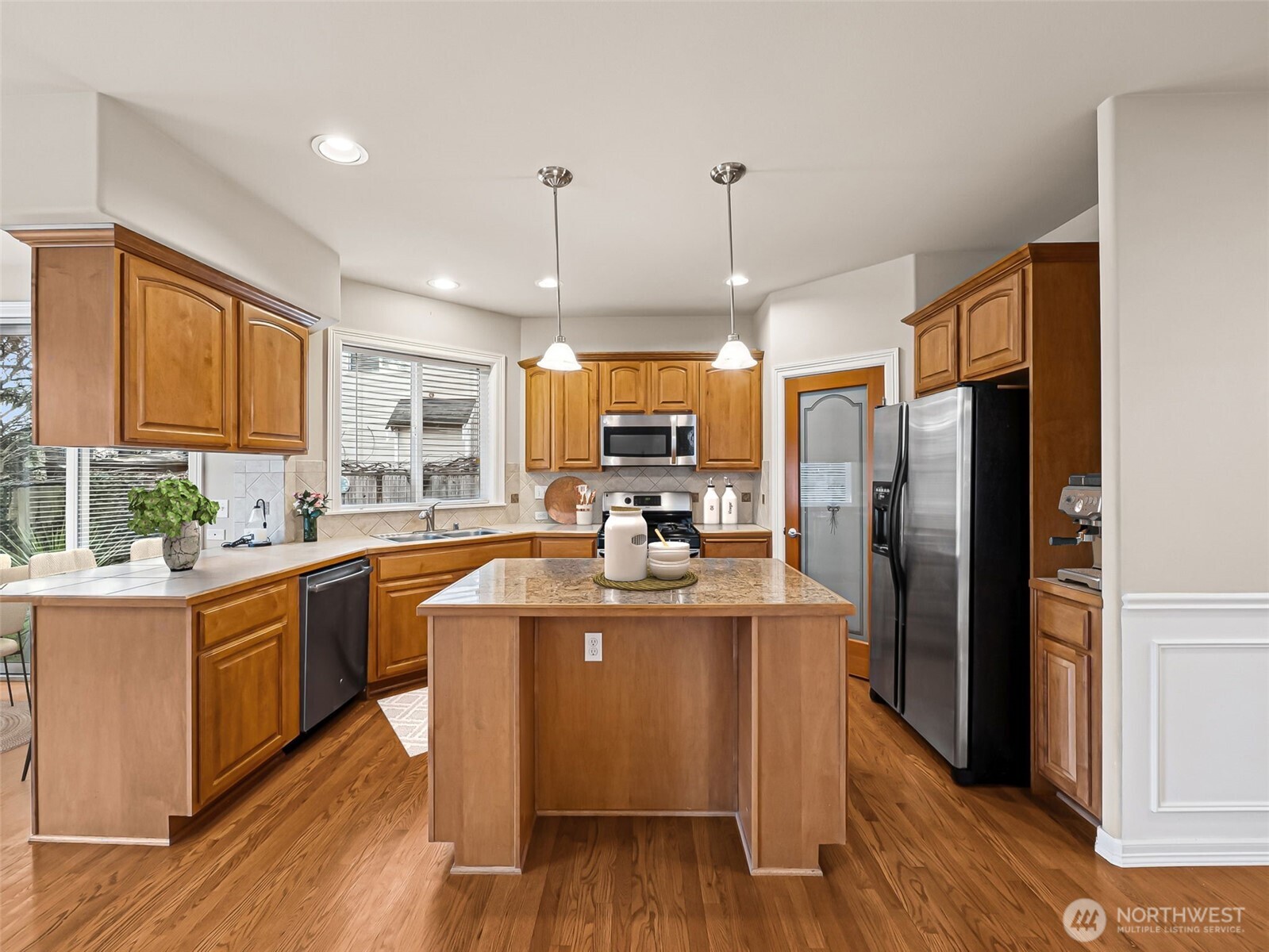 Kitchen open to family room, walk-in pantry.