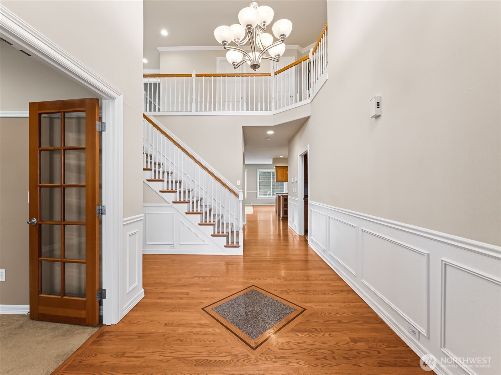 View from entry, cathedral ceiling, den to left (or 5th bedroom).