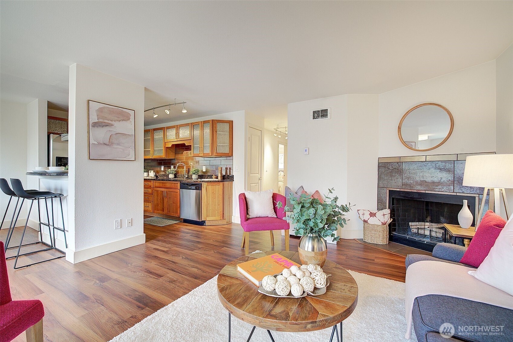 Beautiful glass-front cabinets compliment the granite countertops and stainless appliances.