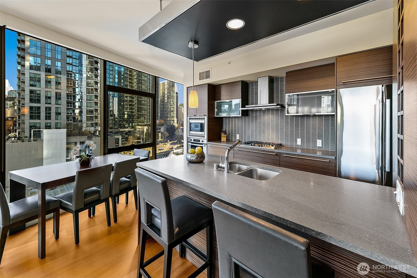 The SE corner curved window wall creates a functional dining space with a view.