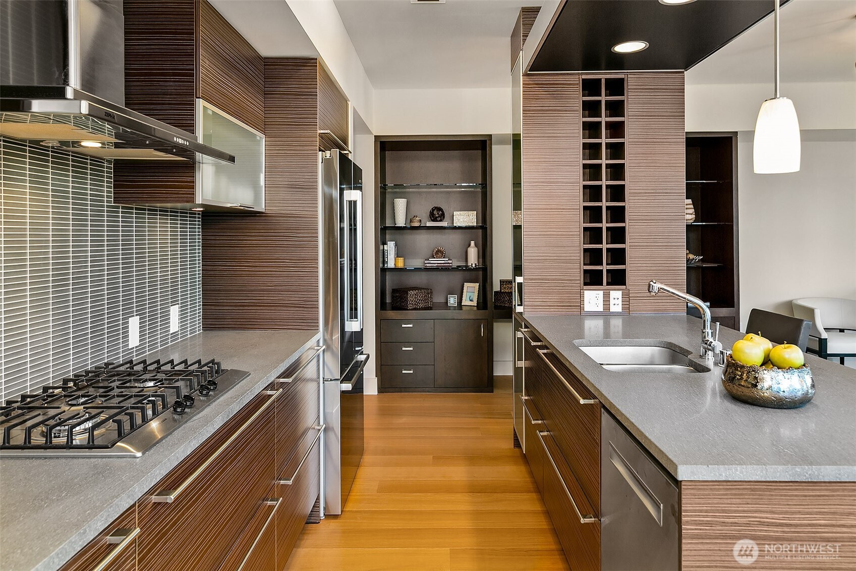 Gas cooktop, basaltina stone slab counters, new refrigerator and dishwasher, tons of storage, convenient built-ins.