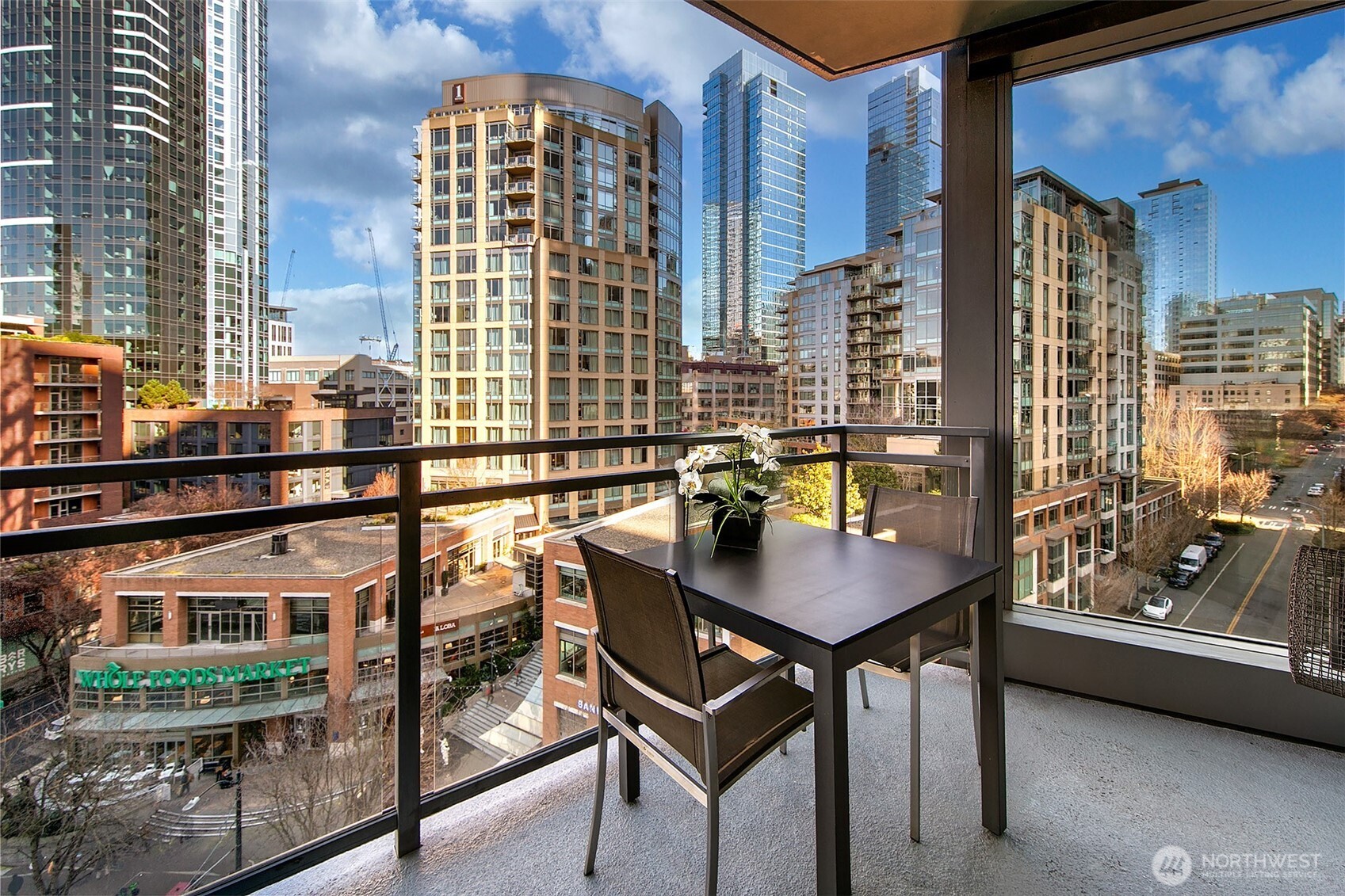 Private covered deck with a great vantage point over the Westlake corridor with the city and Lake Union view on display.