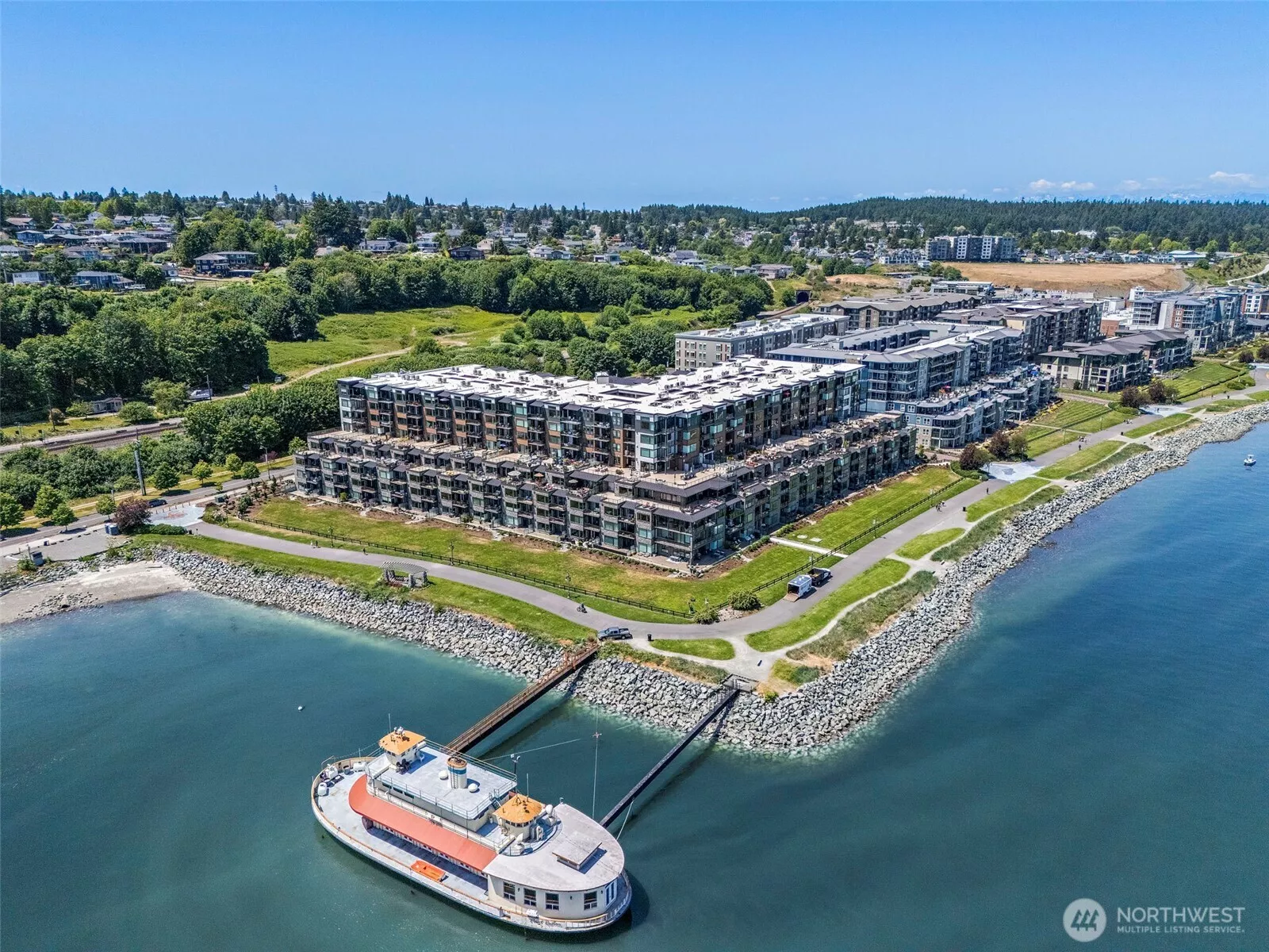 Live in the Rainier Condos located in the vibrant Point Ruston community with panoramic views of the sound and Mt Rainier along the nearly mile-long "Waterwalk" paved walking trail connecting to Point Defiance park and the Ruston Way waterfront.
