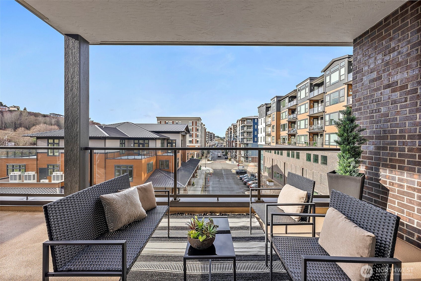 Soak up the PNW sunshine views from the covered balcony/deck overlooking the Point Ruston Village community.