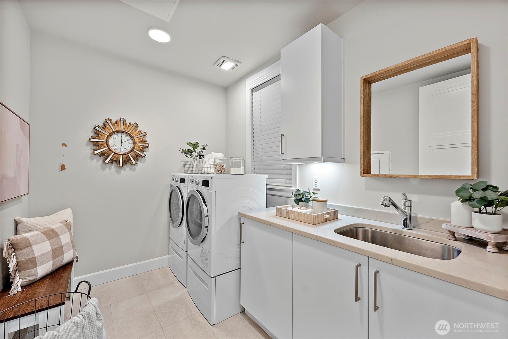Spacious Laundry room with utility sink and vanity storage