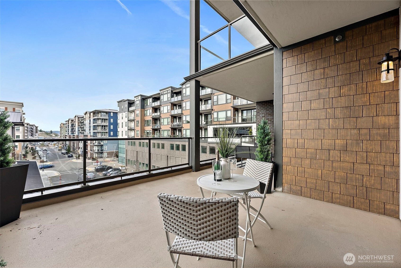 Primary suite nook of balcony looking out to the Village view of Point Ruston. Walk down to Anthem for Saturday morning coffee and come back to sit and enjoy the view. Matinee movies at Cinemark Theatre and enjoy the sunset from the comfort of home. Dinner in the village or pickup takeout at one of the many restaurants within walking distance—Sushi Town, Wildfin, Farrell's Pizza, Copper & Salt, Jewel Box Café, Stacks 571; and don't forget about dessert or a cool summer treat at Ice Cream Social.